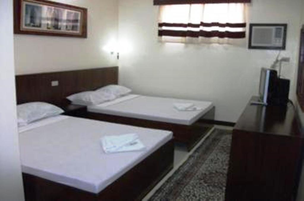 Ysabelle Mansion Bed and Breakfast Puerto Princesa Kamer foto