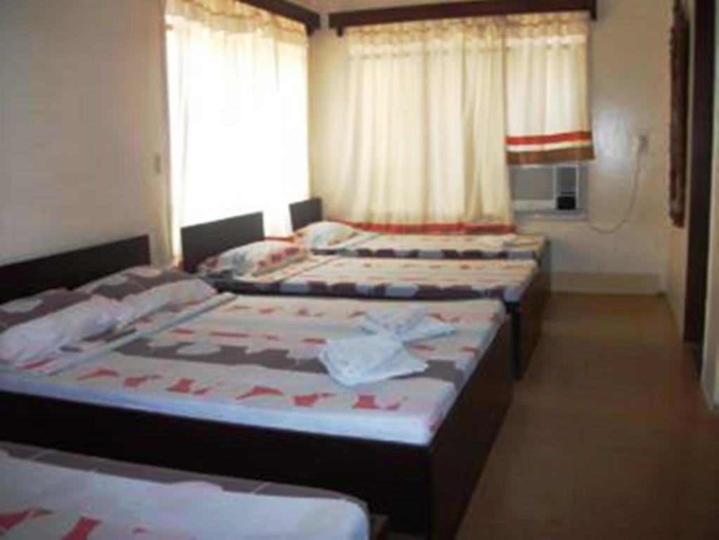 Ysabelle Mansion Bed and Breakfast Puerto Princesa Kamer foto
